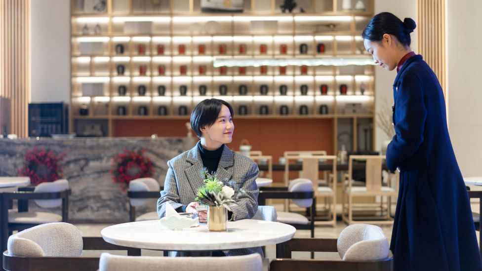 Gratuities are now acceptable in China, especially in bigger cities and grand hotels (Credit: dowell/Getty Images)