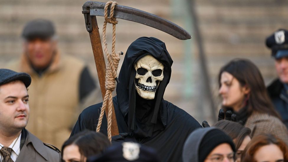 A movie extra dressed as the grim reaper in New York City (Credit: Getty Images)